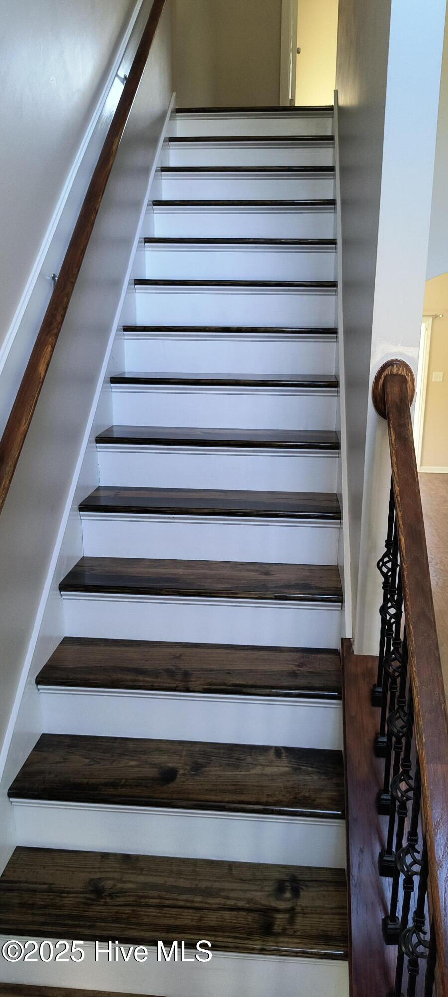 419 Lafitte Way New Bern, NC 28560 - Photo 3 of 15 Updated: Stairs without carpet. New treads with new paint. LVP in hallway upstairs between bedrooms.