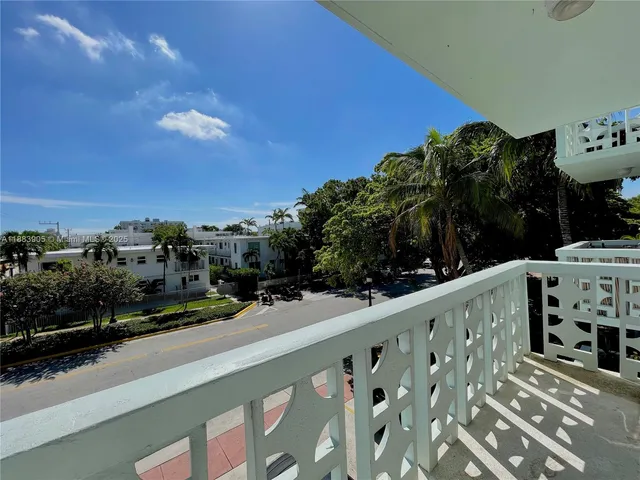 a view of a street from a balcony