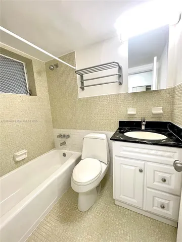 a view of a balcony with two chairs and a table