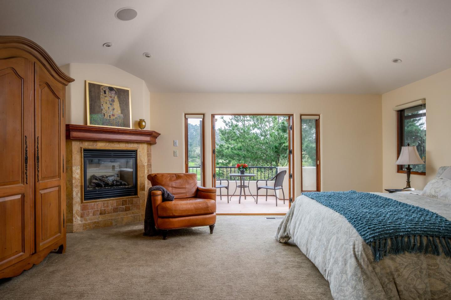 1060 Rodeo Road Pebble Beach, CA 93953 - Photo 19 of 30 a bedroom with a bed and a fireplace