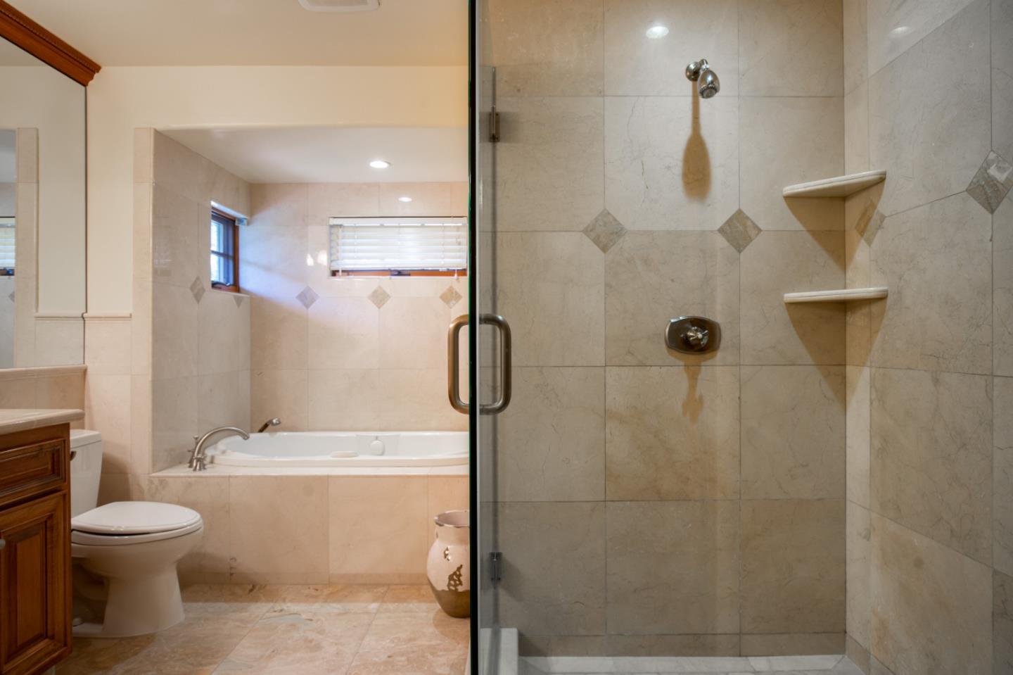 1060 Rodeo Road Pebble Beach, CA 93953 - Photo 22 of 30 a bathroom with a toilet sink and shower