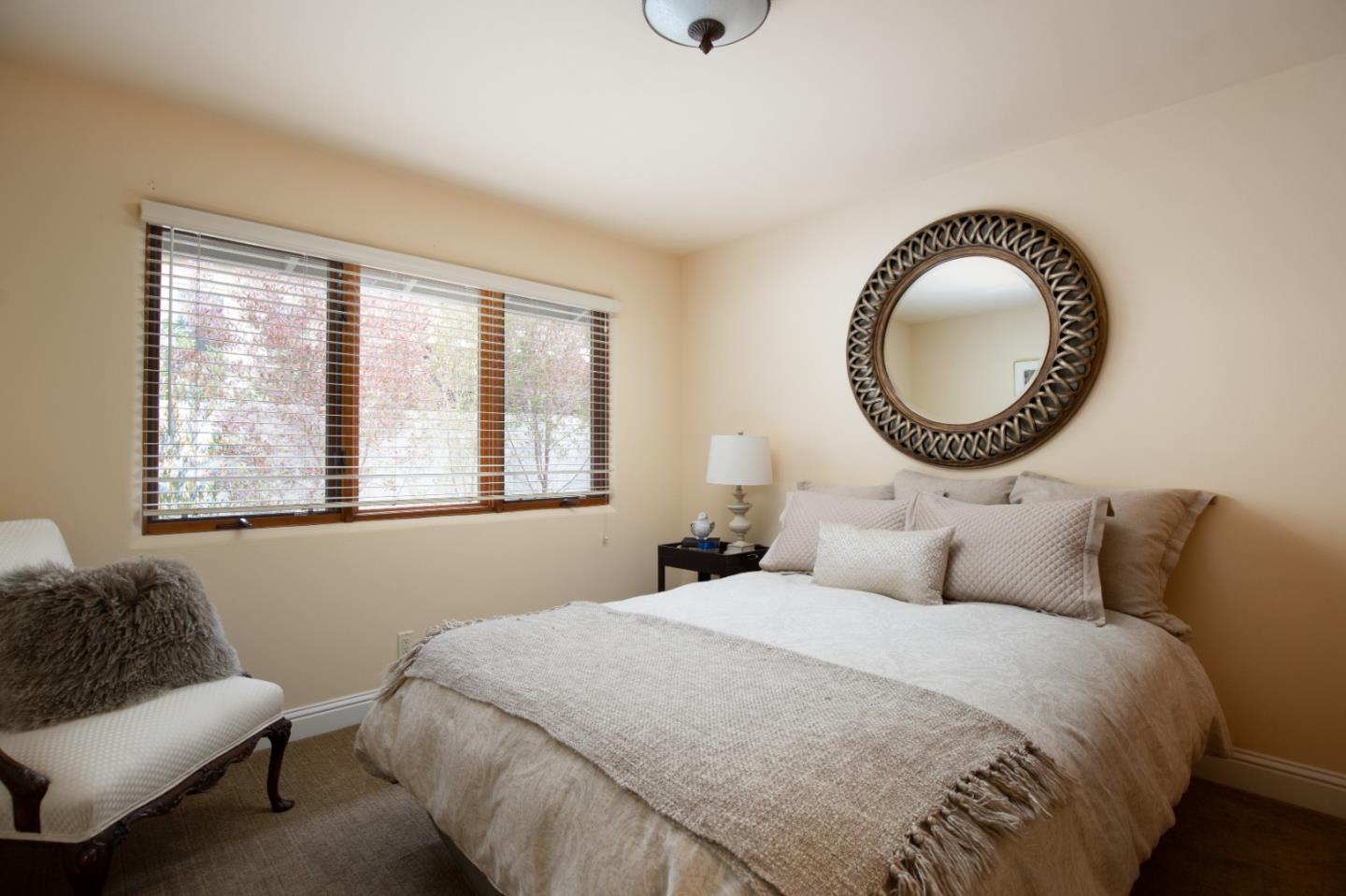 1060 Rodeo Road Pebble Beach, CA 93953 - Photo 23 of 30 a bedroom with a bed and a window