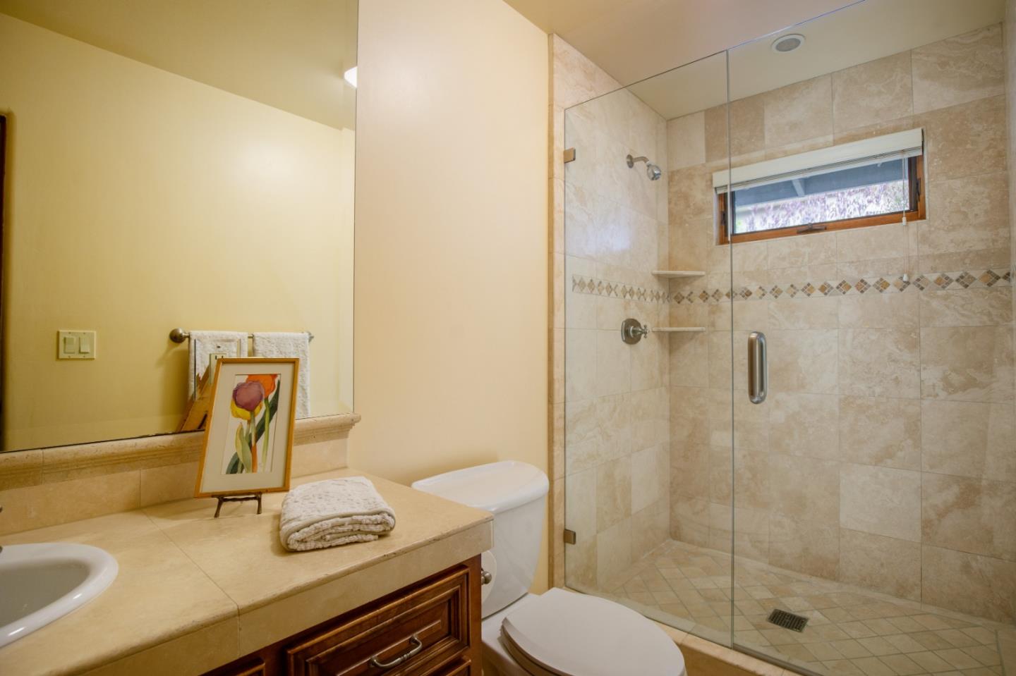 1060 Rodeo Road Pebble Beach, CA 93953 - Photo 24 of 30 a bathroom with a sink toilet and shower