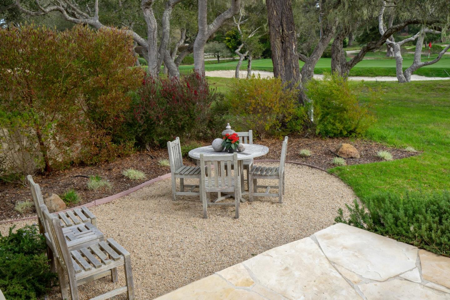 1060 Rodeo Road Pebble Beach, CA 93953 - Photo 28 of 30 a patio with table and chairs and potted plants