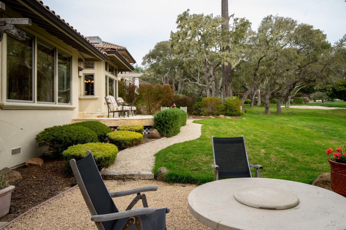 1060 Rodeo Road Pebble Beach, CA 93953 - Photo 29 of 30 a view of a chairs and table in backyard