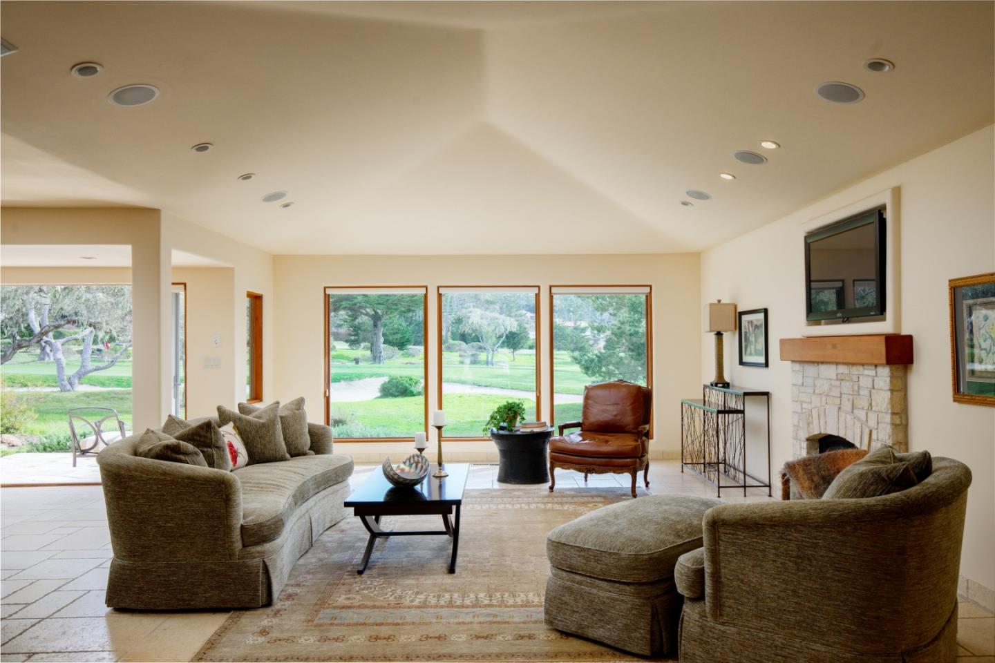 1060 Rodeo Road Pebble Beach, CA 93953 - Photo 4 of 30 a living room with furniture and a fireplace