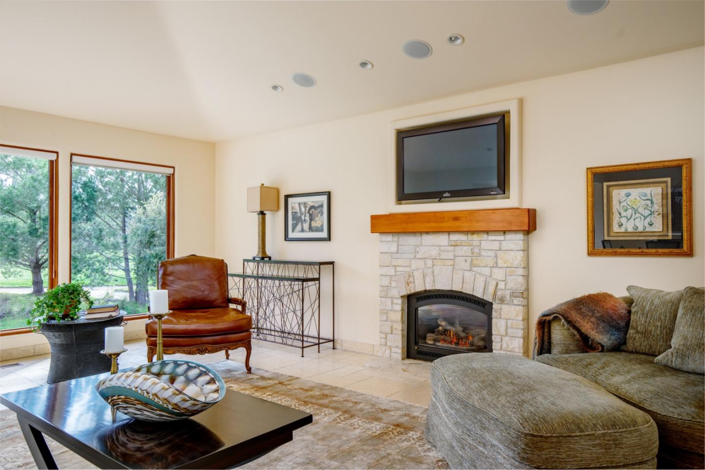 1060 Rodeo Road Pebble Beach, CA 93953 - Photo 5 of 30 a living room with furniture and a fireplace