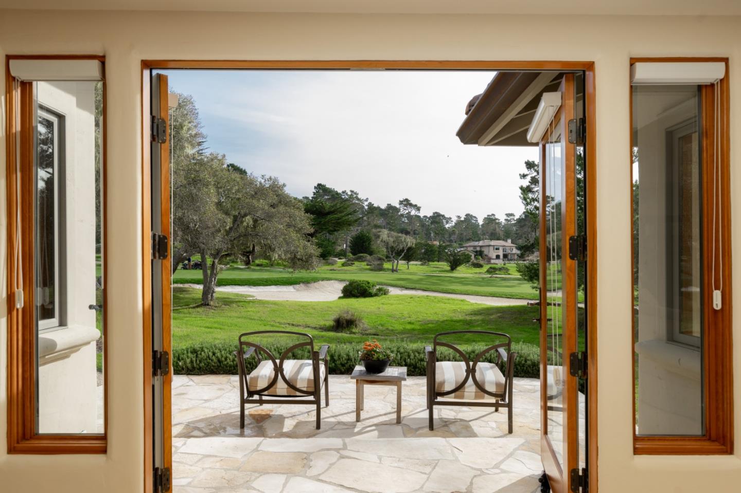1060 Rodeo Road Pebble Beach, CA 93953 - Photo 8 of 30 a view of a two chairs and table in a backyard