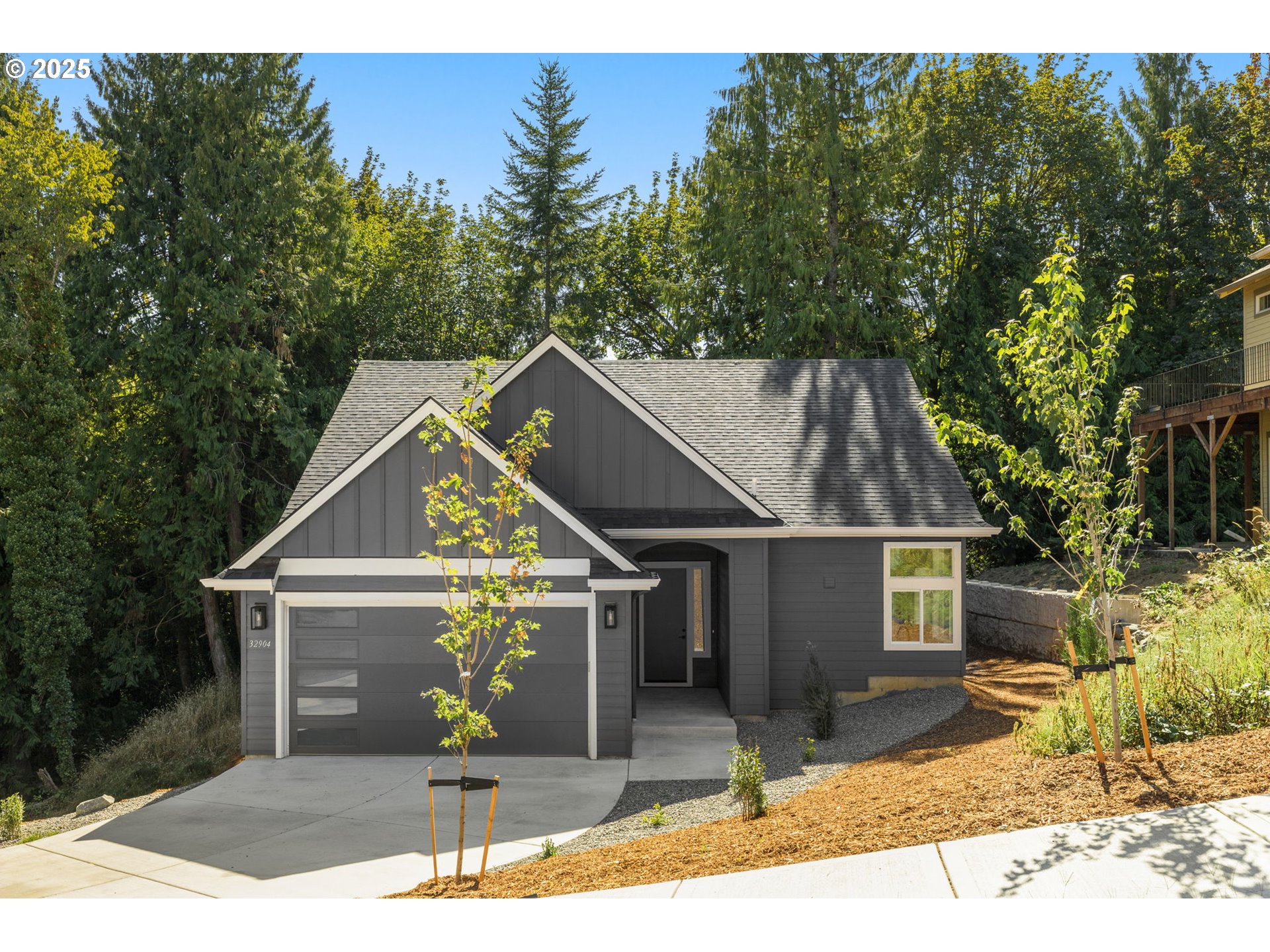 32904 Northwest View Terrace Place Scappoose, OR 97056 - Photo 1 of 34 a house view with a outdoor space