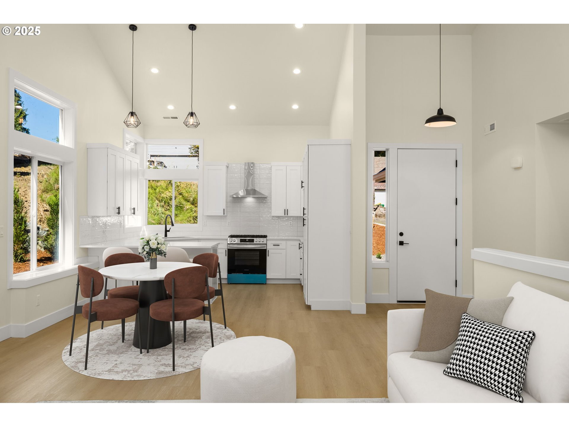 32904 Northwest View Terrace Place Scappoose, OR 97056 - Photo 11 of 34 a living room with furniture and a chandelier