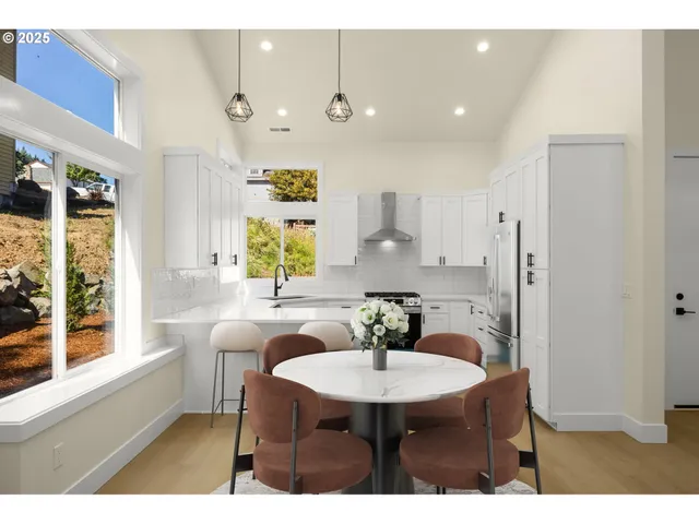 a view of a dining room with furniture and window