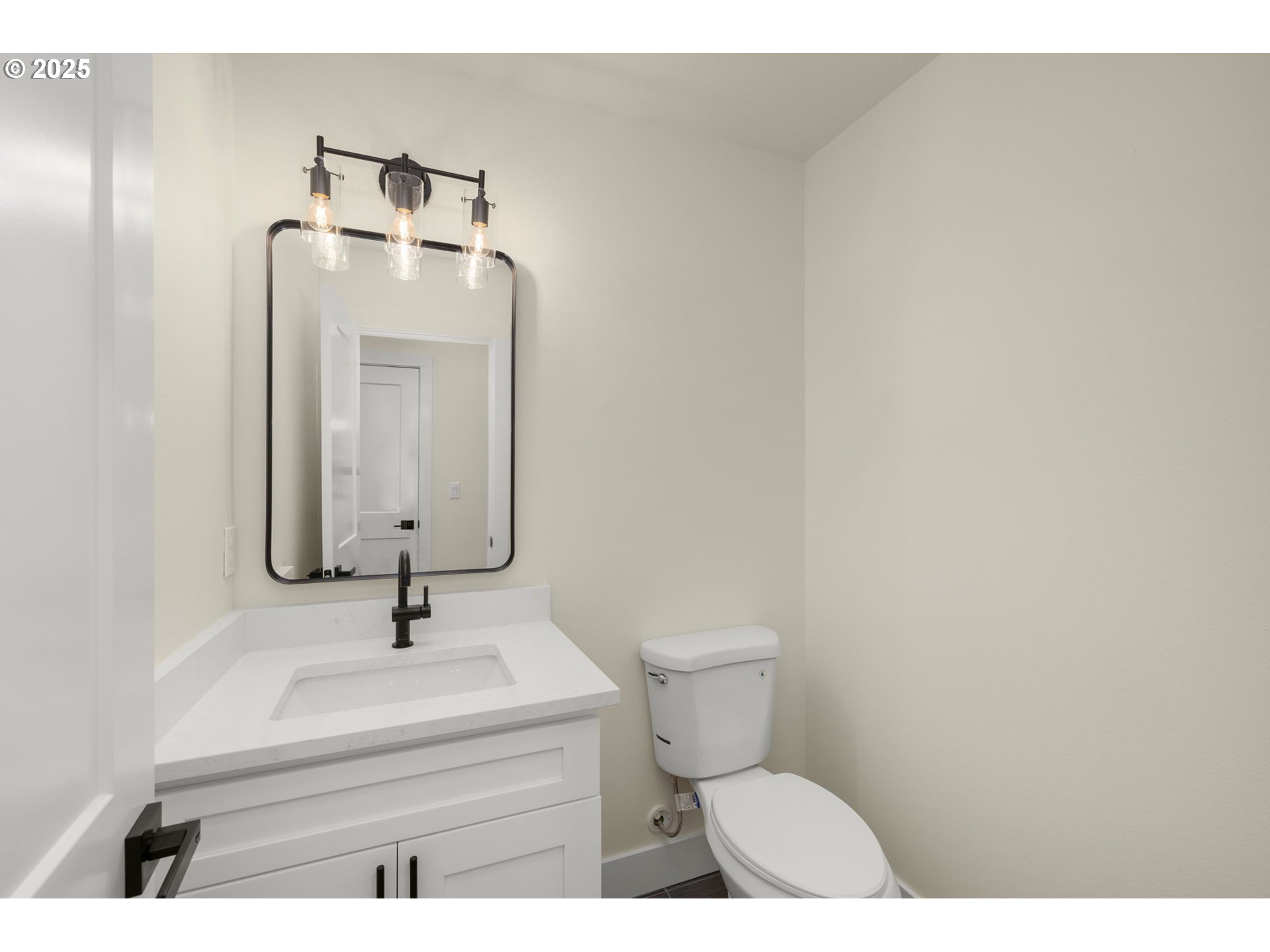 32904 Northwest View Terrace Place Scappoose, OR 97056 - Photo 17 of 34 a bathroom with a sink a toilet and mirror