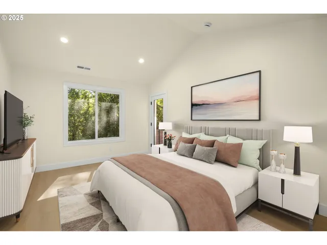 a bedroom with a large bed and a flat screen tv