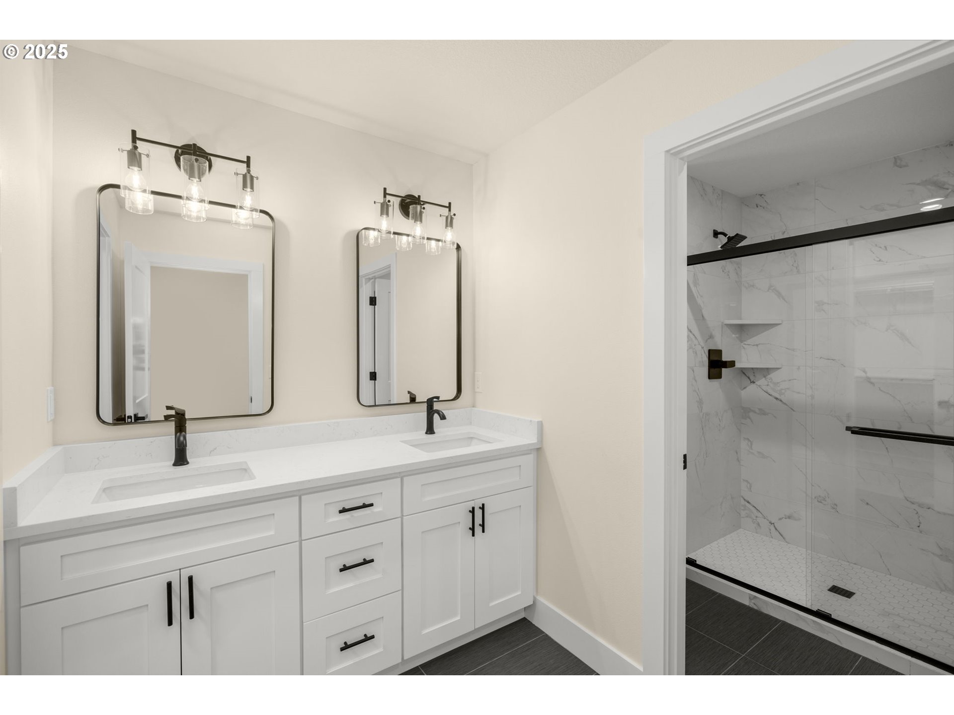 32904 Northwest View Terrace Place Scappoose, OR 97056 - Photo 20 of 34 a bathroom with a double vanity sink mirror and shower