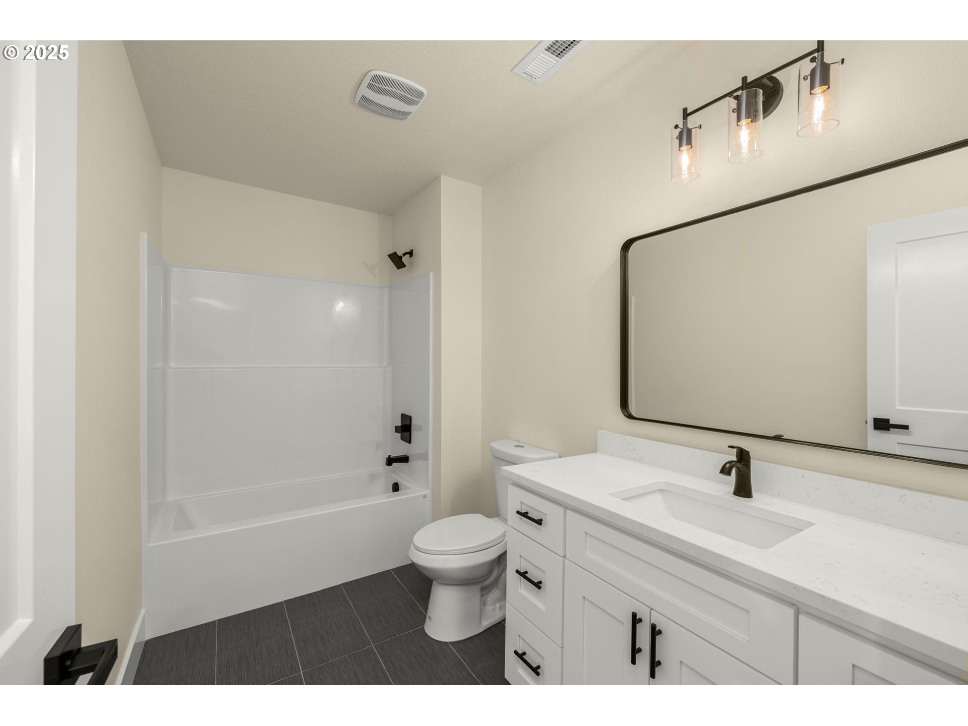 32904 Northwest View Terrace Place Scappoose, OR 97056 - Photo 26 of 34 a bathroom with a sink a toilet and shower