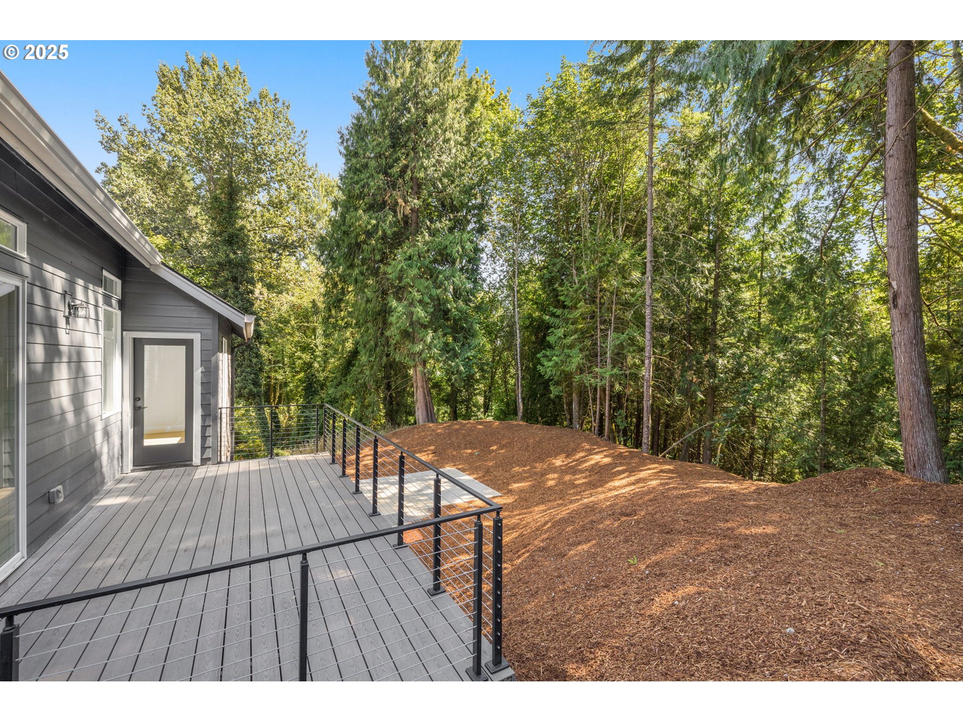 32904 Northwest View Terrace Place Scappoose, OR 97056 - Photo 28 of 34 a view of backyard with a deck and wooden floor