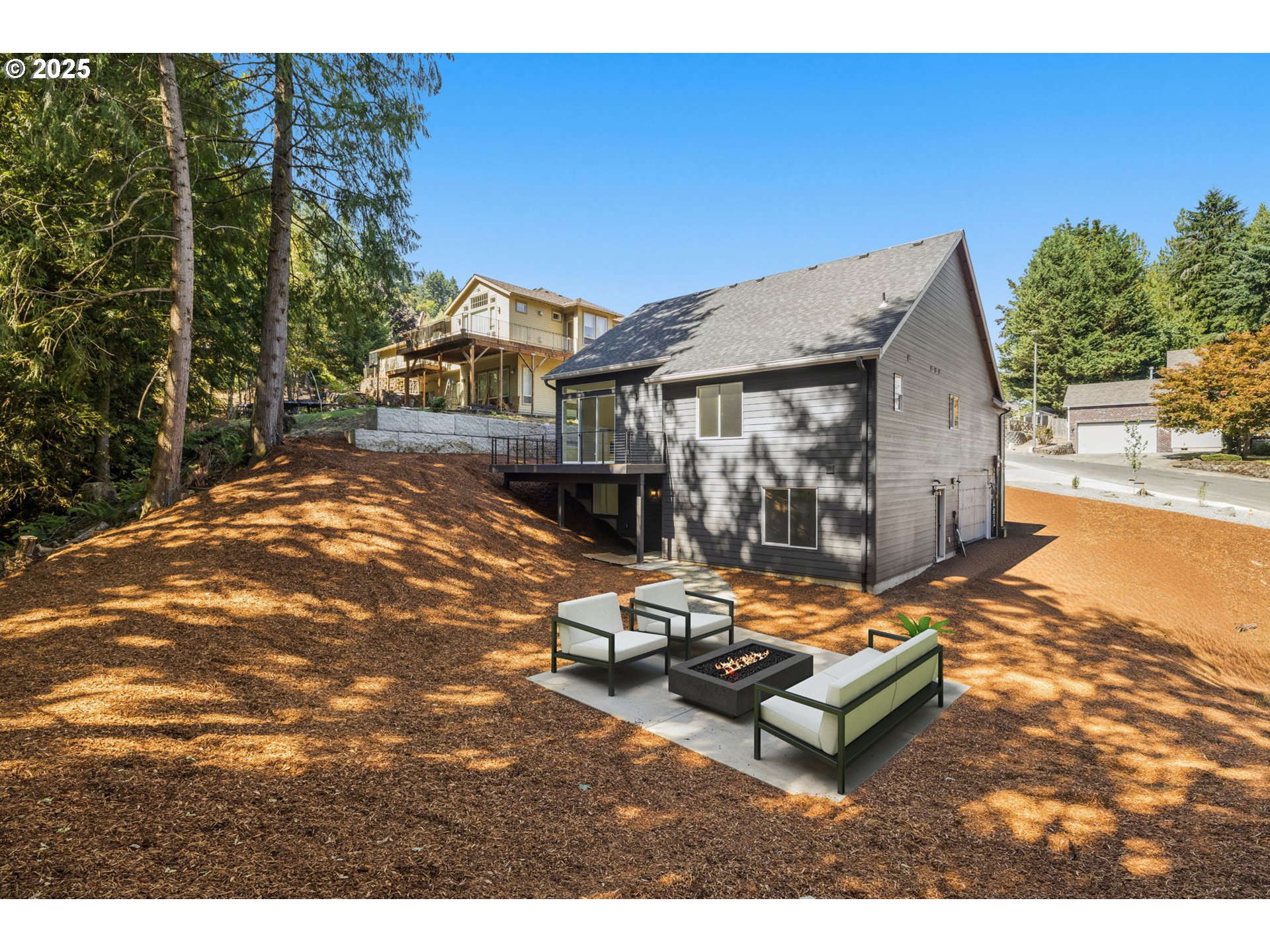 32904 Northwest View Terrace Place Scappoose, OR 97056 - Photo 30 of 34 a backyard of a house with yard and outdoor seating