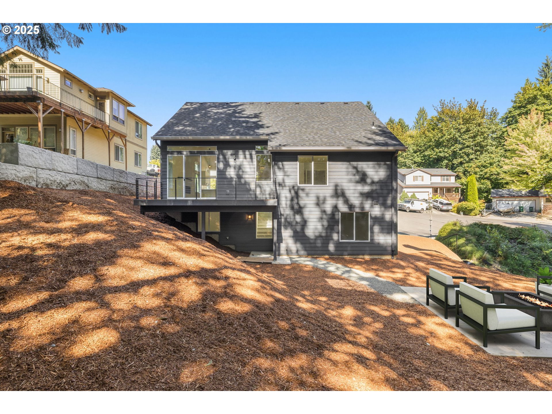32904 Northwest View Terrace Place Scappoose, OR 97056 - Photo 31 of 34 a view of a house with a patio