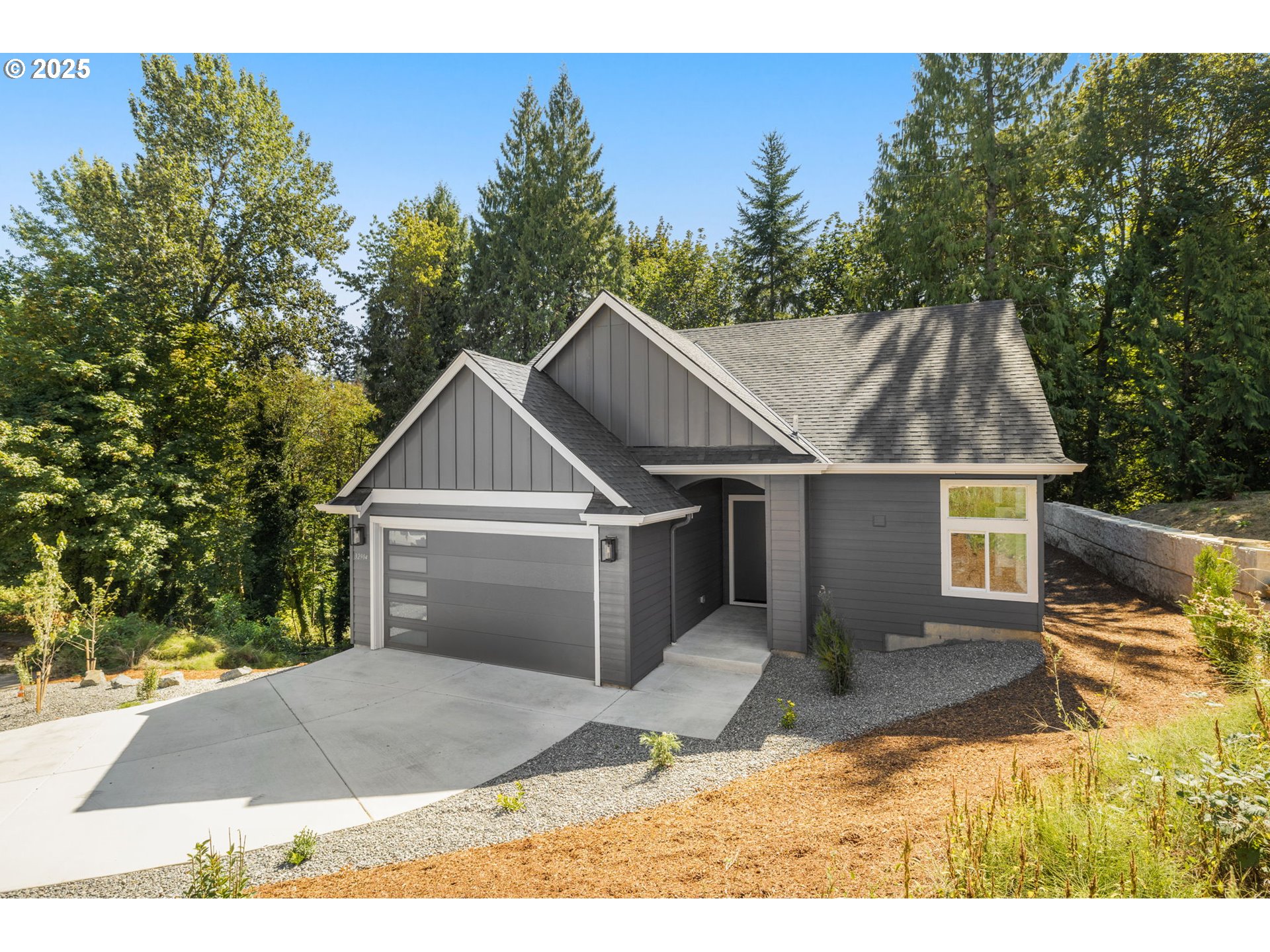 32904 Northwest View Terrace Place Scappoose, OR 97056 - Photo 4 of 34 a view of a house with a yard