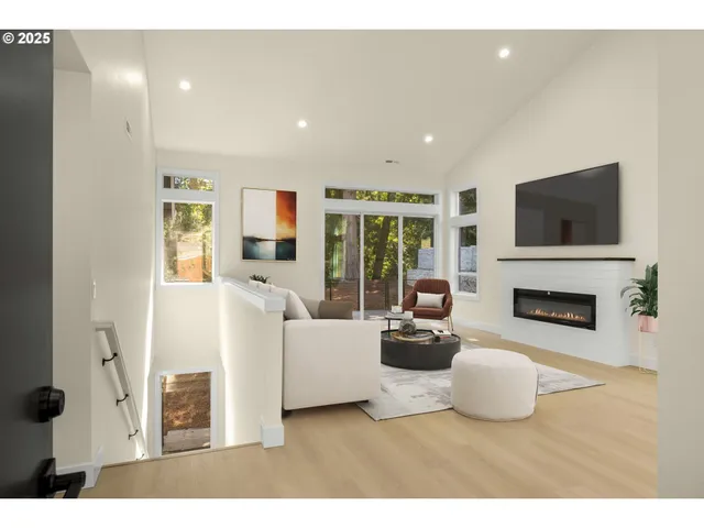 a living room with furniture a fireplace and a flat screen tv
