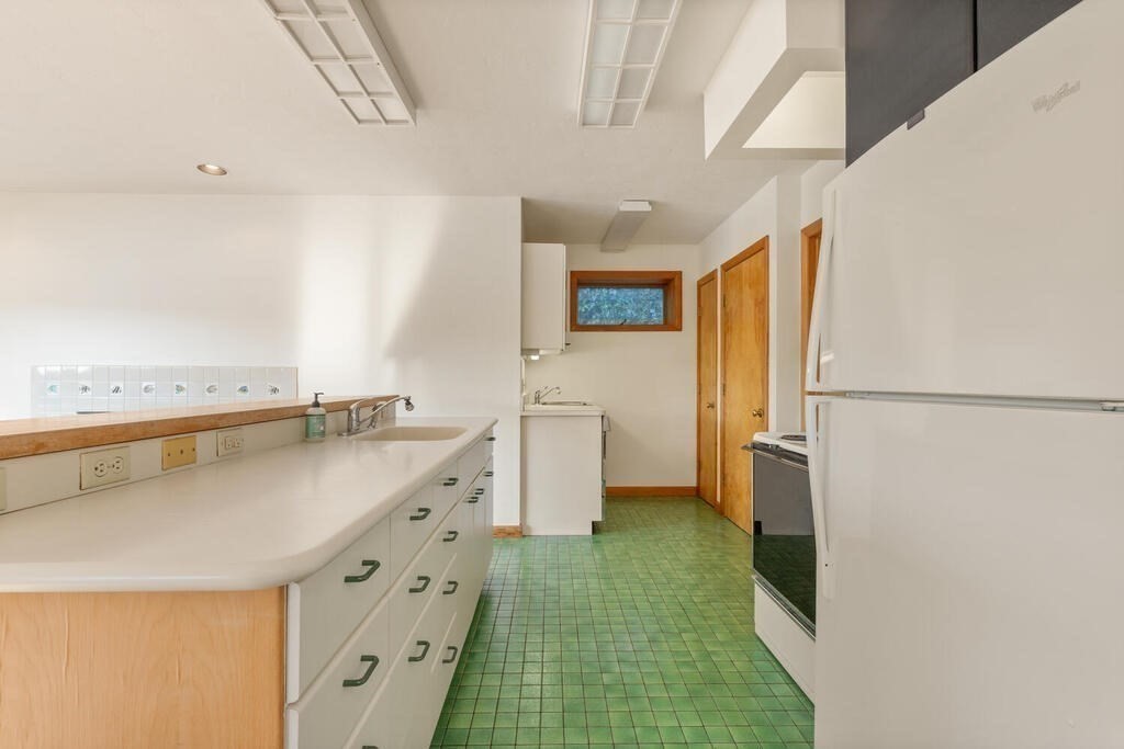 98 Dudley Road Wayland, MA 01778 - Photo 15 of 41 a kitchen with cabinets a sink and a stove