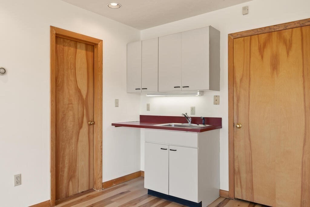 98 Dudley Road Wayland, MA 01778 - Photo 21 of 41 a view of a storage and utility room with washer and dryer