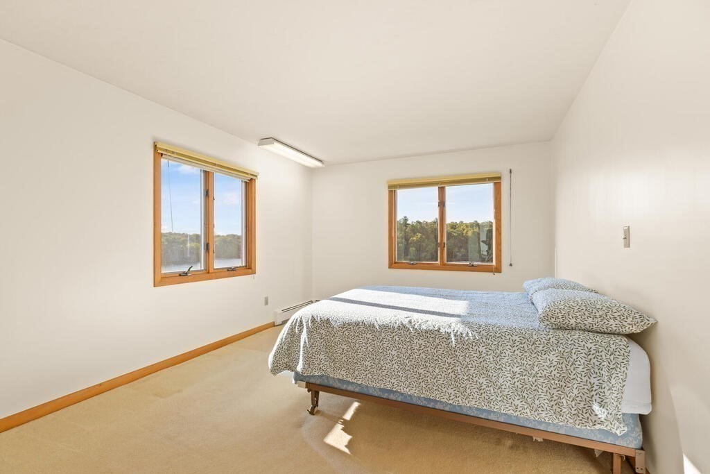 98 Dudley Road Wayland, MA 01778 - Photo 22 of 41 a bedroom with a bed and window