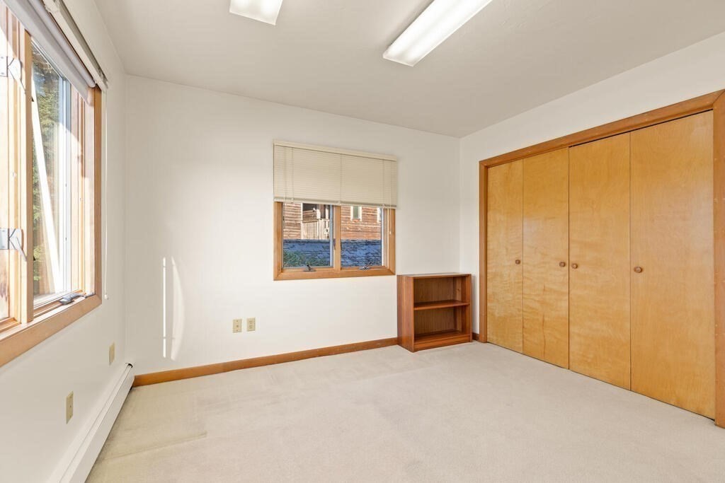 98 Dudley Road Wayland, MA 01778 - Photo 25 of 41 a view of an empty room with a window