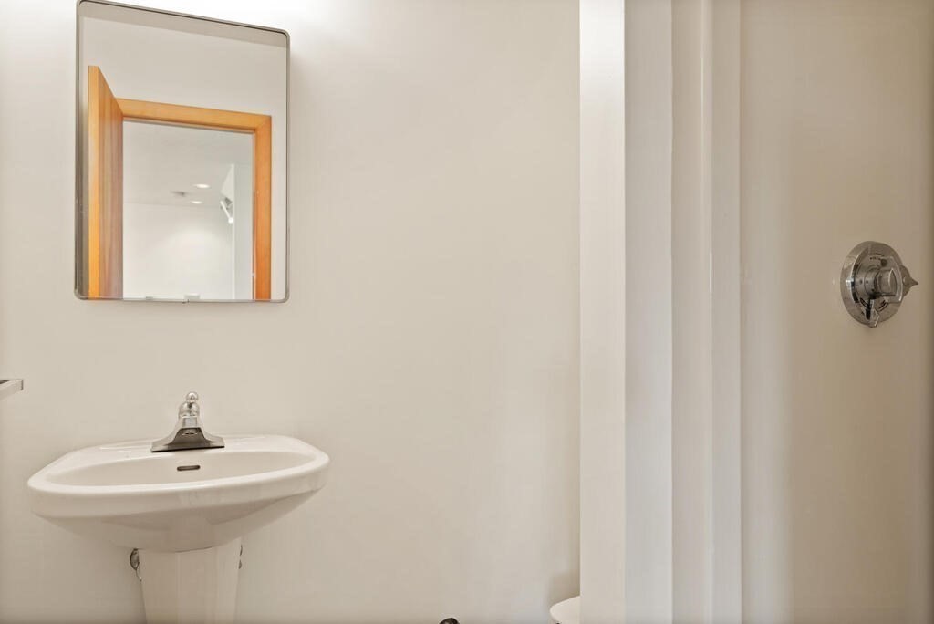 98 Dudley Road Wayland, MA 01778 - Photo 28 of 41 a bathroom with a sink and a mirror