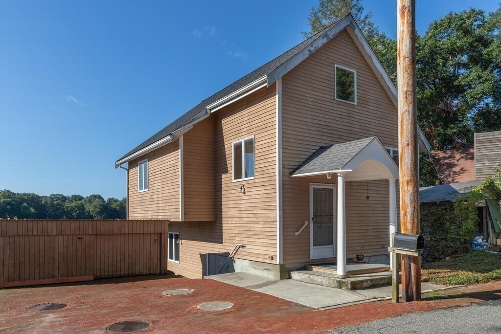 98 Dudley Road Wayland, MA 01778 - Photo 5 of 41 a view of a house with a backyard