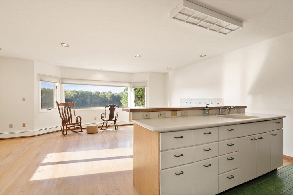 98 Dudley Road Wayland, MA 01778 - Photo 9 of 41 a living room with granite countertop furniture and a large window