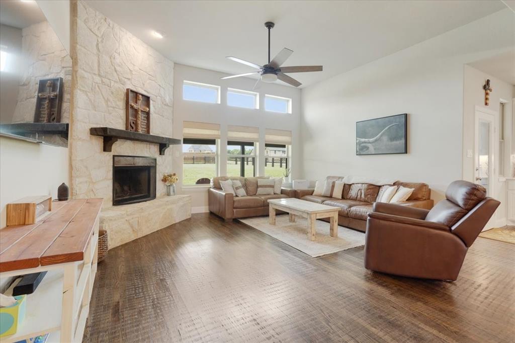 1205 Redbud Street Howe, TX 75459 - Photo 4 of 40 a living room with furniture fireplace and flat screen tv