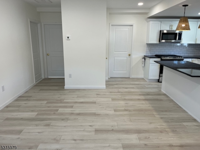 1283 Springfield Avenue, Unit B New Providence, NJ 07974 - Photo 3 of 15 a view of kitchen with sink and wooden floor