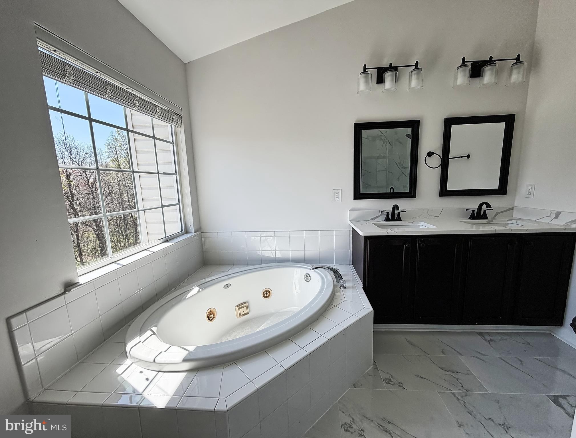 1816 Graymount Way Edgewood, MD 21040 - Photo 11 of 23 a bathroom with a tub sink and mirror