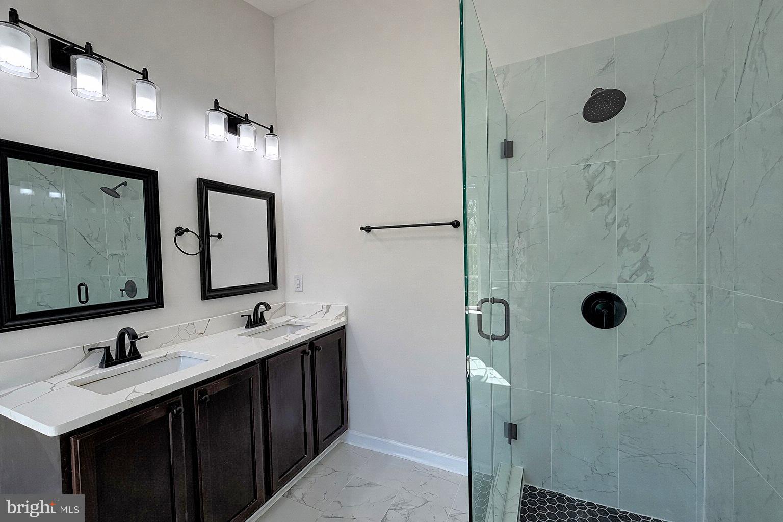 1816 Graymount Way Edgewood, MD 21040 - Photo 12 of 23 a bathroom with a double vanity sink mirror and shower