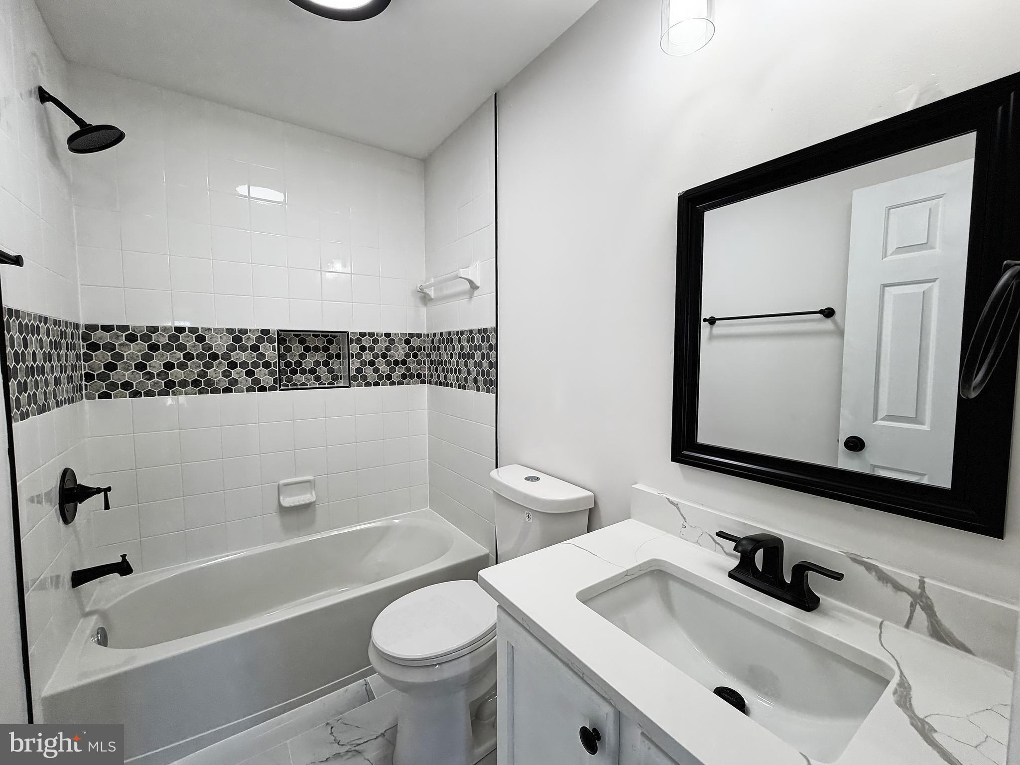 1816 Graymount Way Edgewood, MD 21040 - Photo 17 of 23 a bathroom with a sink a toilet and shower