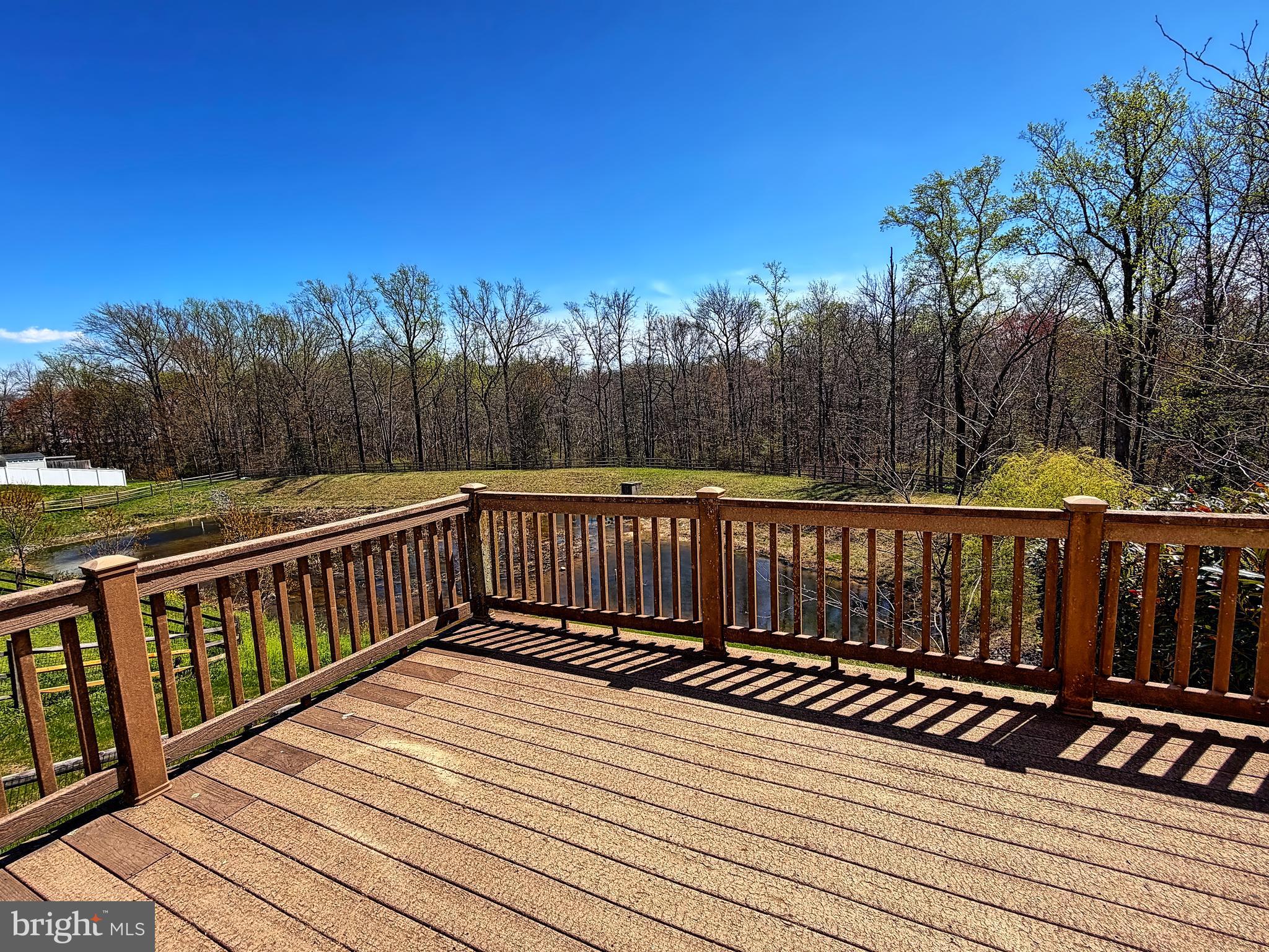 1816 Graymount Way Edgewood, MD 21040 - Photo 22 of 23 a view of deck with wooden floor and trees in the background