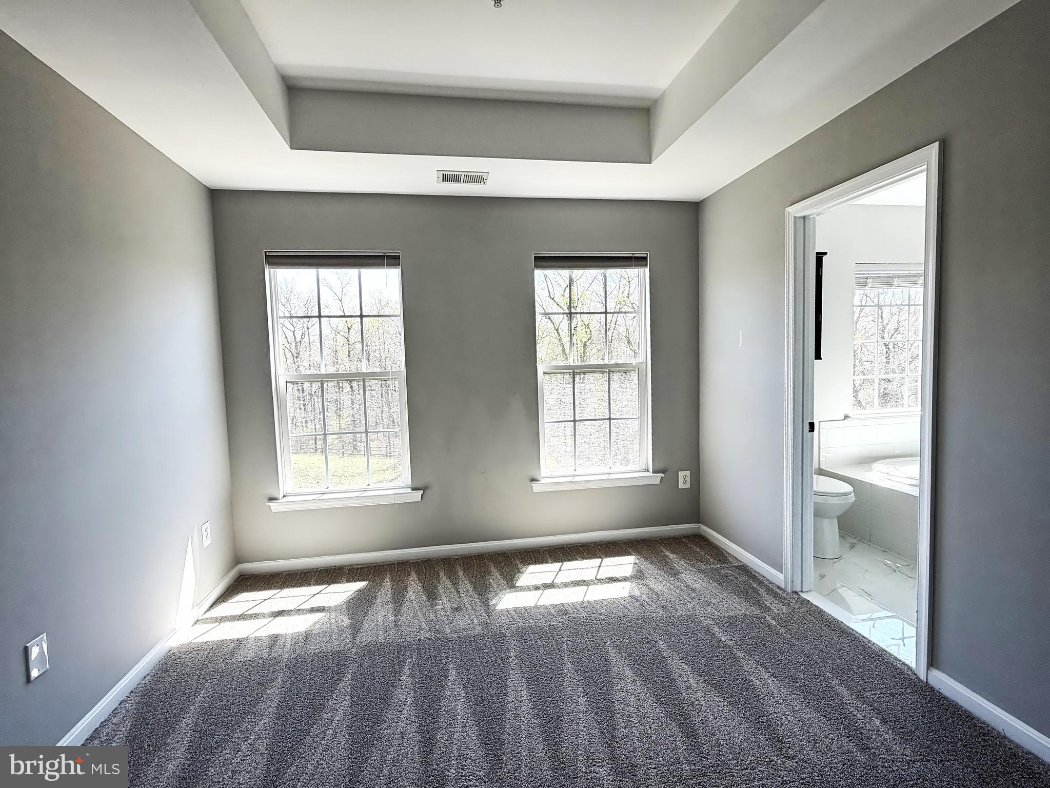 1816 Graymount Way Edgewood, MD 21040 - Photo 10 of 23 an empty room with wooden floor and windows