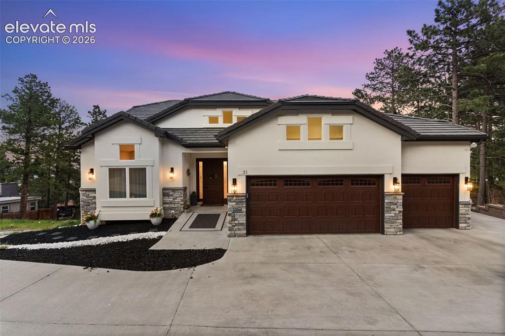 21 Leaming Road Colorado Springs, CO 80906 - Photo 3 of 48 Contemporary stucco exterior with stone accents