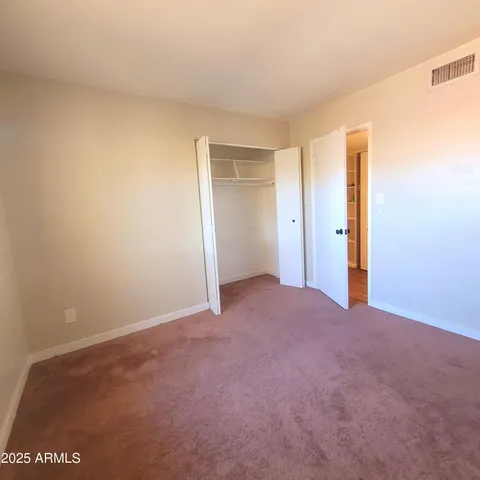 a bathroom with a toilet a sink and a mirror
