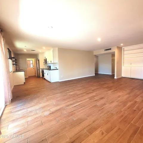 a view of a kitchen with furniture and a kitchen view
