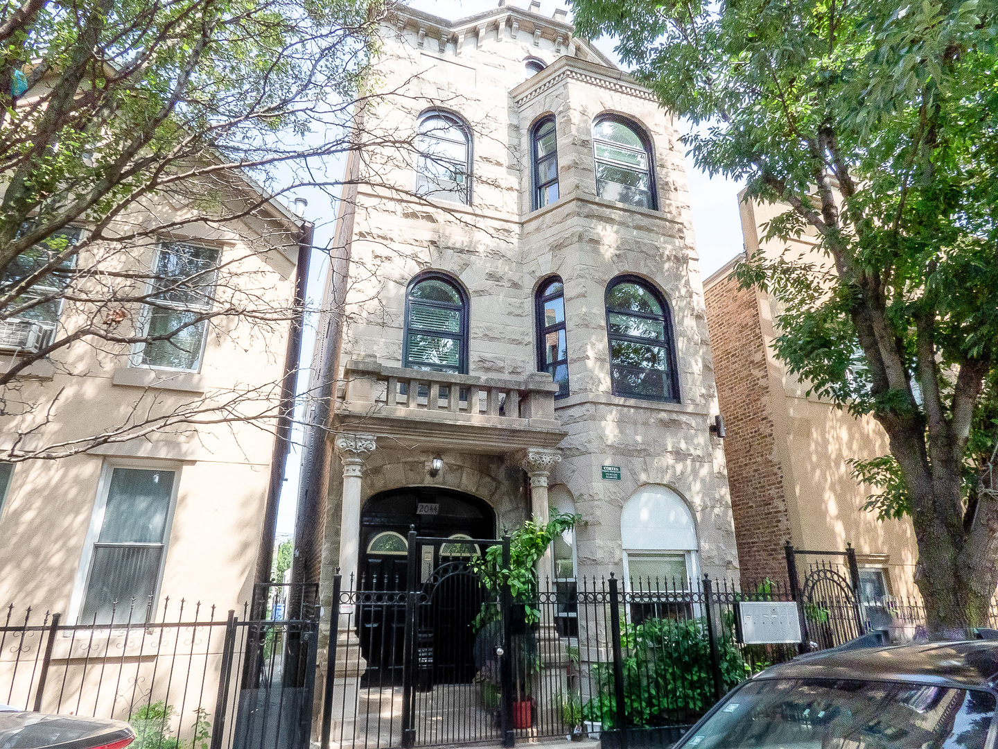 2044 West 19th Street, Unit 3R Chicago, IL 60608 - Photo 1 of 11 a front view of a house with yard