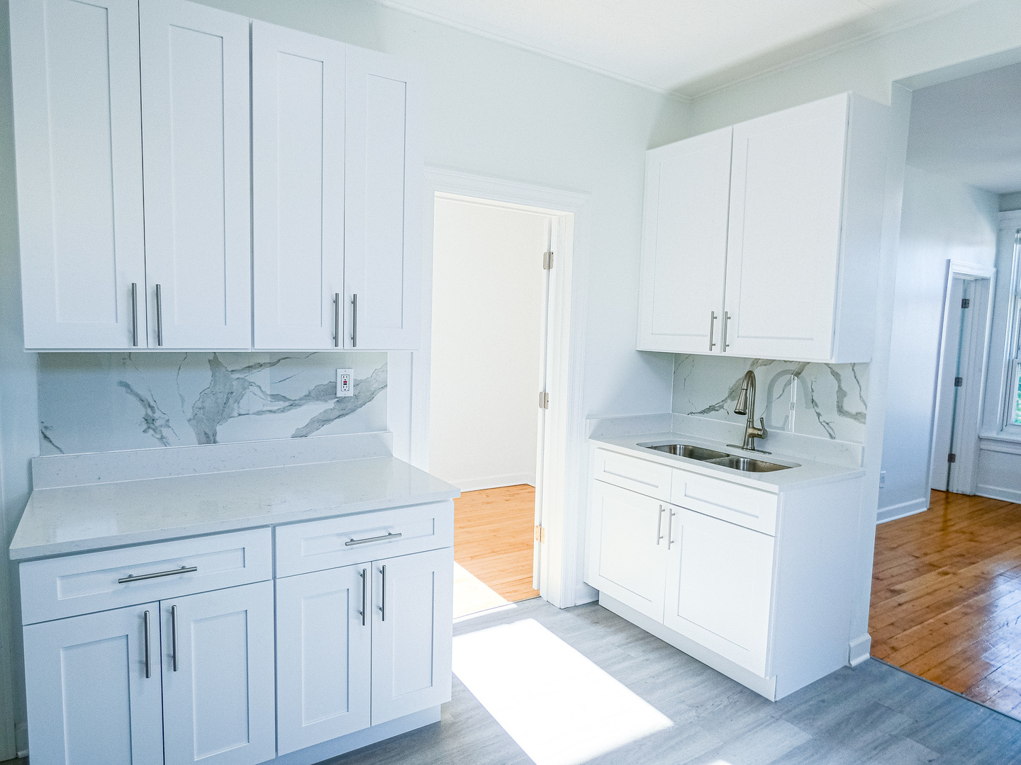 2044 West 19th Street, Unit 3R Chicago, IL 60608 - Photo 3 of 11 a kitchen with stainless steel appliances granite countertop a sink and dishwasher a stove with wooden floor