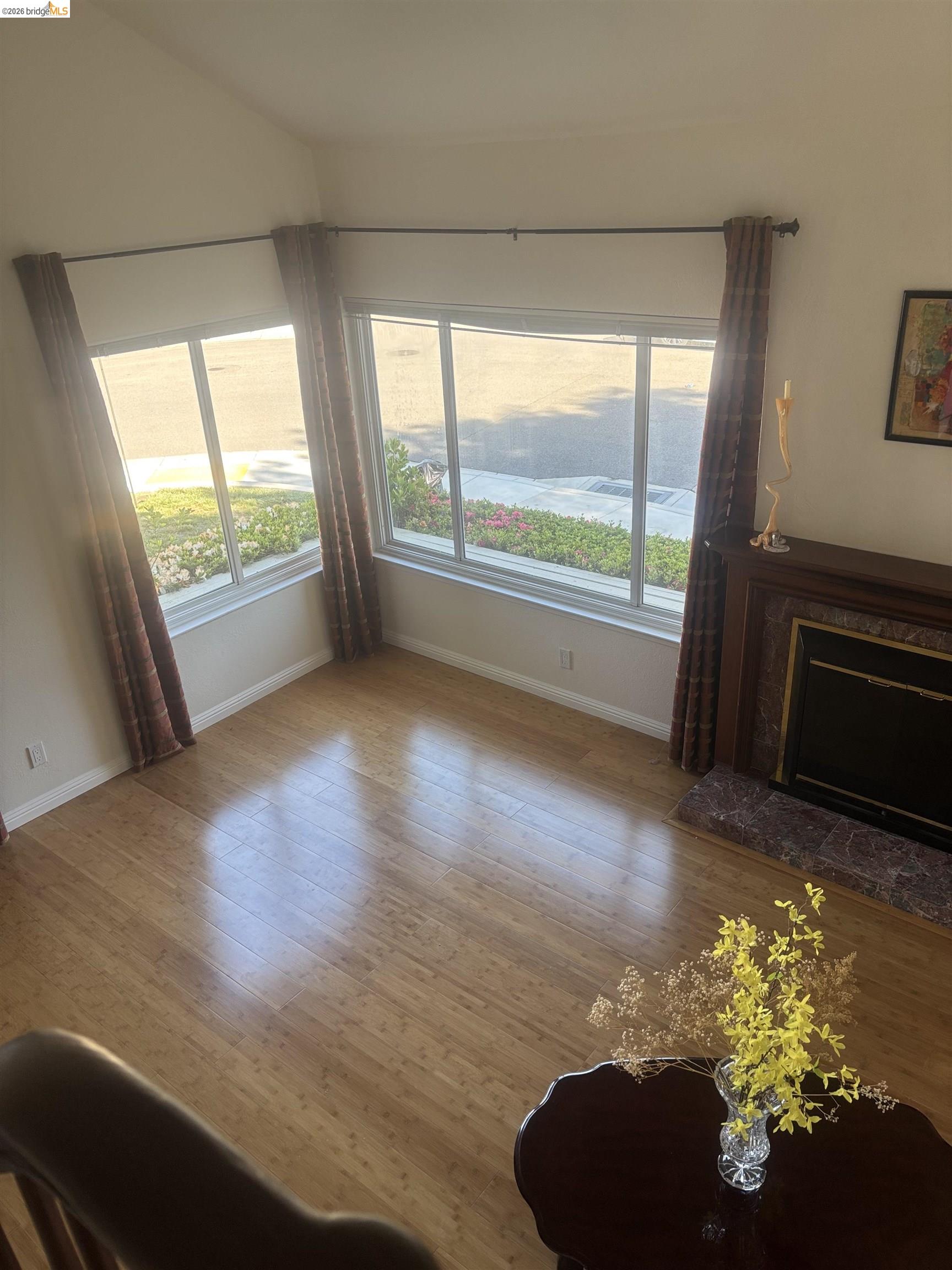 10013 Foxboro Circle San Ramon, CA 94583 - Photo 16 of 39 a view of empty room with floor to ceiling window and wooden floor