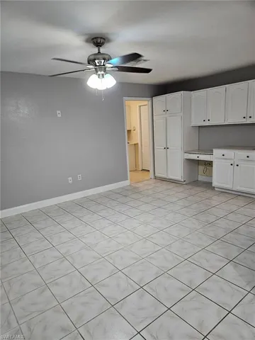 a view of a kitchen with marble kitchen and cabinets