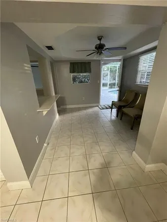 a view of an empty room and a window