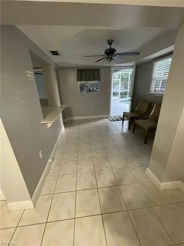 a view of an empty room and a window