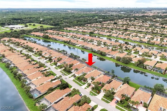 an aerial view of city and lake