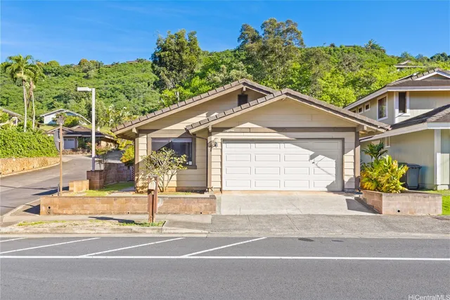 a view of a house with a street