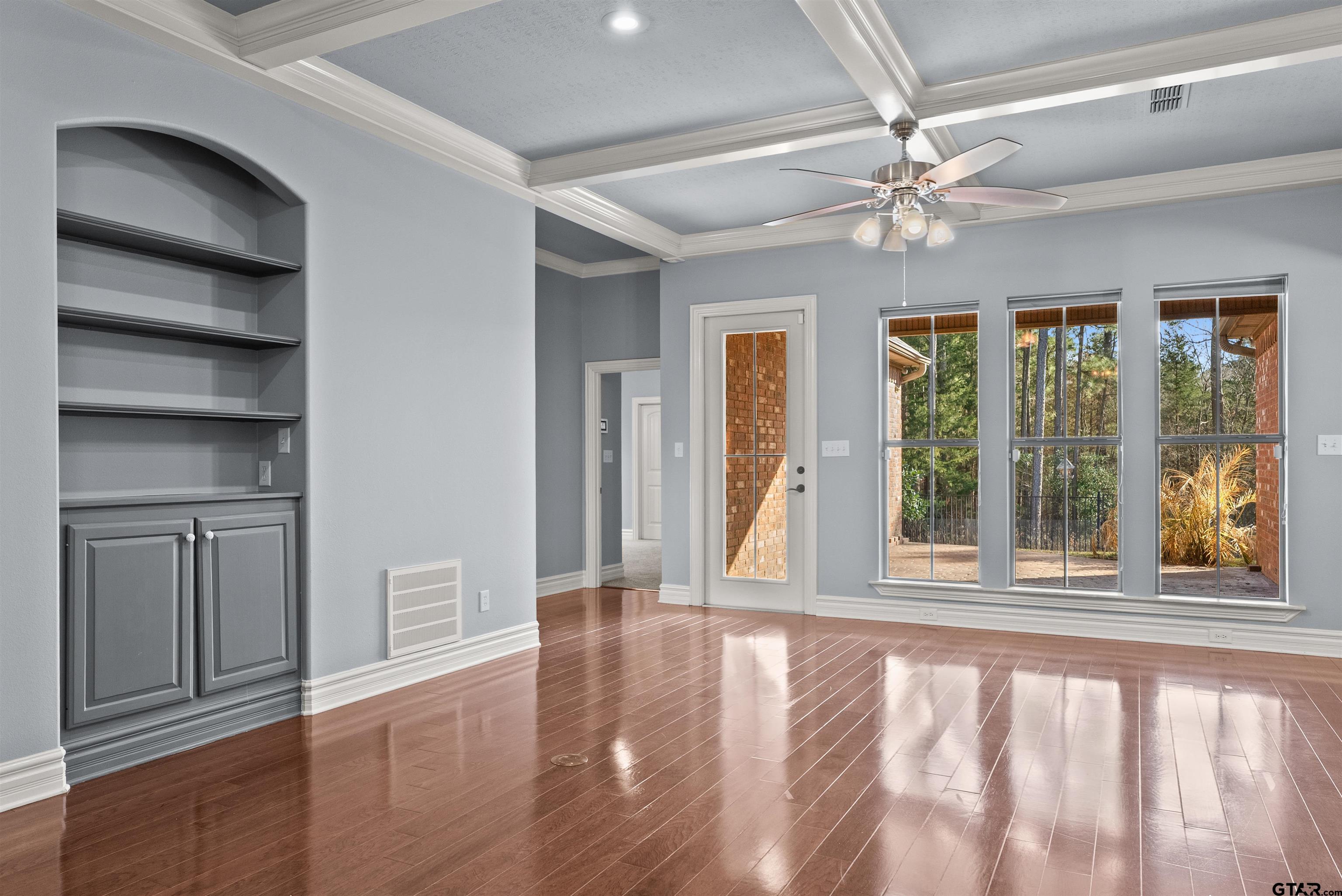 714 Huntwick Lane Tyler, TX 75703 - Photo 11 of 39 a view of an empty room with a window and wooden floor